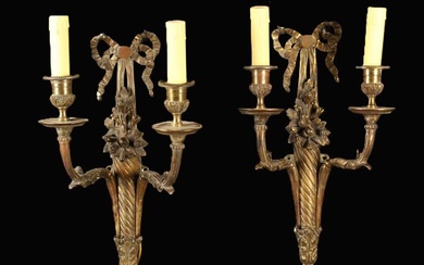 A Pair of Louis XVI Style Gilt Bronze Twin-branch Wall Sconces. The wall mounts cast as wrythen horn