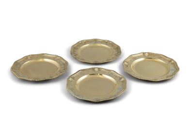 A SET OF FOUR GEORGE II SILVER GILT DINNER PLATES, London 1...