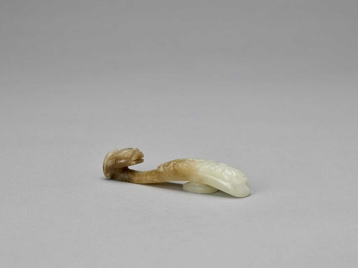 A WHITE AND RUSSET JADE 'DRAGON' BELT HOOK, QING