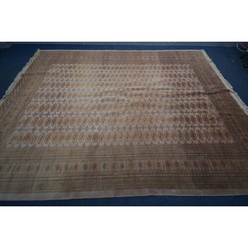 A WOOLLEN RUSSET TEKKE CARPET SQUARE, with a multi strap bor...