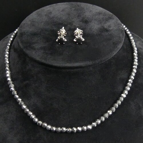 A black diamond bead 51 cm necklace with a silver clasp and ...