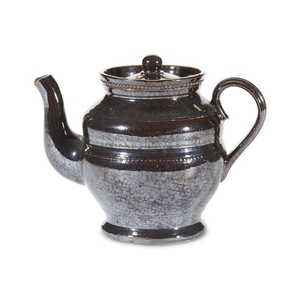 A black-glazed redware teapot Attributed to Thomas Haig's Pottery...