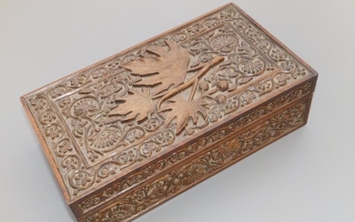 A carved teak box decorated with leaves & arabesque...