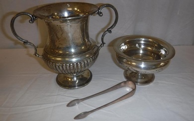 A collection of silver ware to include a twin-handled...