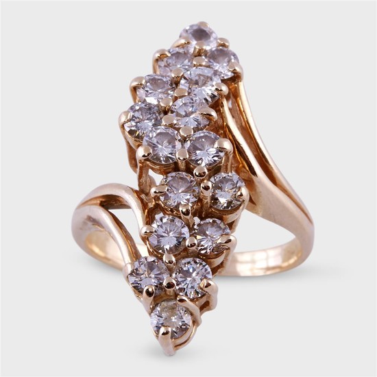 A diamond and fourteen karat gold ring designed as...