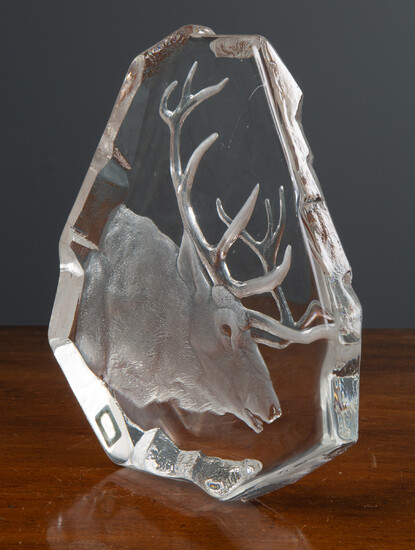 A glass sculpture of a stag's head
