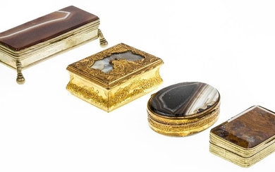 A group of four brass-mounted agate boxes, late 19th century/early 20th century, comprising: a French snuff box, the cover inset with grey banded agate and decorated with two putto amid scrolls, rocaille and a mask, 5.5cm wide; a stamp box on ball...
