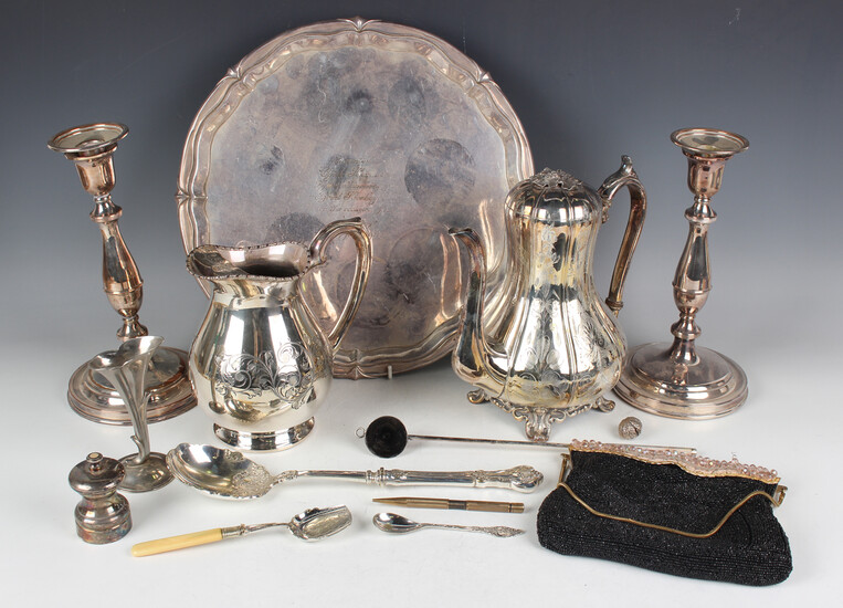 A group of plated items, including a circular salver, a pair of plated-on-copper candlesticks and a