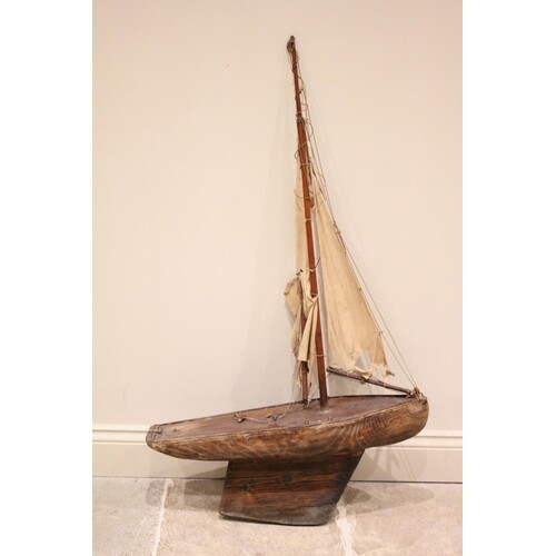 A late 19th/early 20th century pond yacht, with a natural wo...