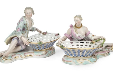 A pair of Meissen porcelain figural sweetmeat baskets, late 19th century, blue crossed swords marks, incised numerals, black 43. marks, modelled as a young man and a young woman reclining by large oval pierced baskets, on plinth bases edged with...