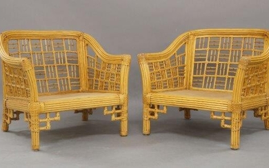 A pair of bamboo lounge chairs, c.1970, the curved backs with geometric open panel work in the Japanese taste, (lacking cushions), each 76cm high, 82cm wide (2)
