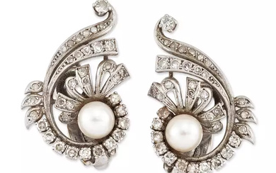 A pair of cultured pearl and diamond earclips, with a cultured pearl, peg set to a spray of...