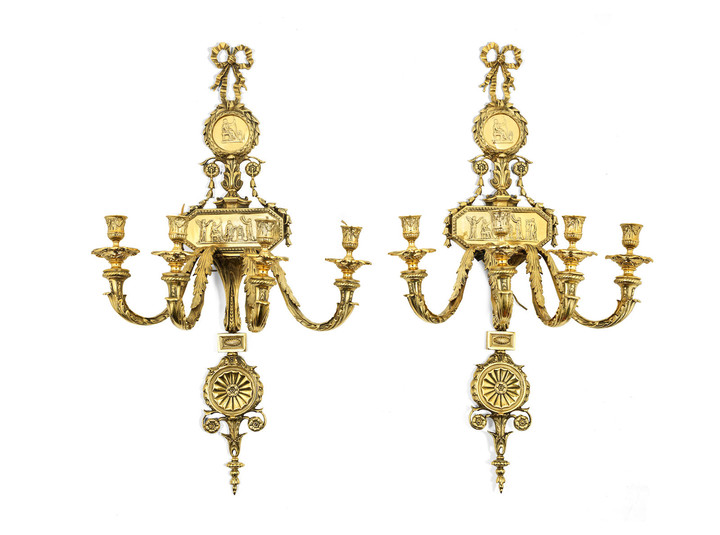 A pair of early 20th century four light polished bronze wall appliques