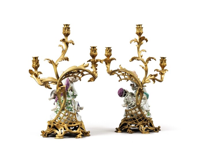 A pair of gilt-bronze and figural porcelain three-light candelabra by Henri Vian, Paris