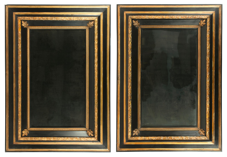 A pair of large ebonised and parcel gilt Continental mirrors, 20th century