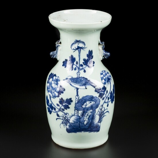 A porcelain vase with celadon fond decorated with a bird among the flowers. China, 19th...