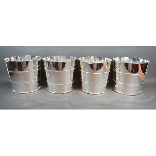 A set of four silver plated wine coolers, each in the form o...