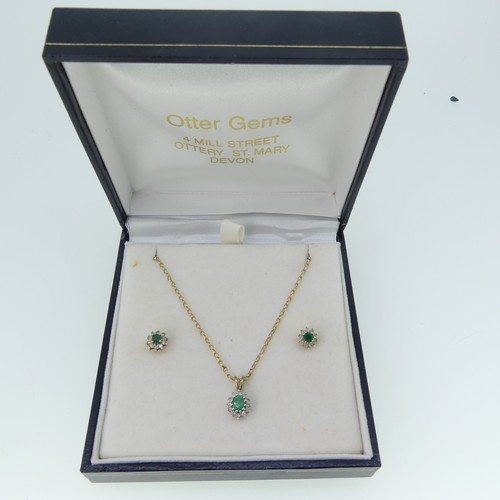 A small emerald and diamond cluster Pendant, on 9ct gold tra...