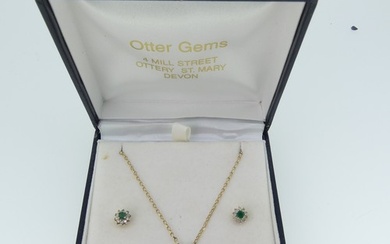 A small emerald and diamond cluster Pendant, on 9ct gold tra...