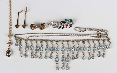A white gold and varicoloured gem set pendant, designed as a foliate spray, detailed '375'