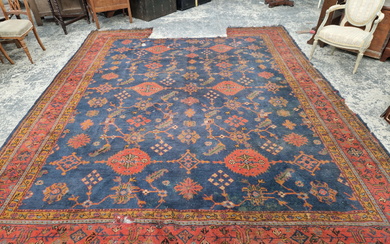 AN ANTIQUE TURKISH OUSHAK CARPET. 390 x 320 cm (LOSSES)
