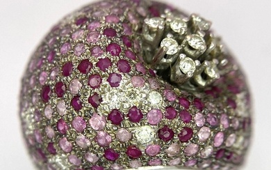 An 18K White Gold Diamond and Ruby Dress Ring. A 1ctw brill...