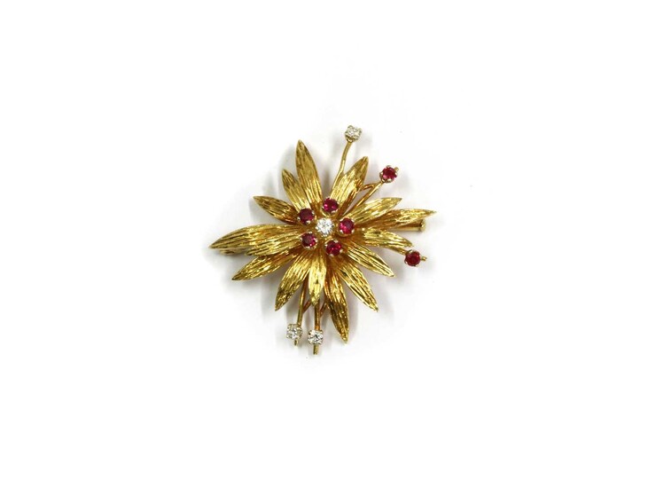 An 18ct gold diamond and ruby flowerhead brooch
