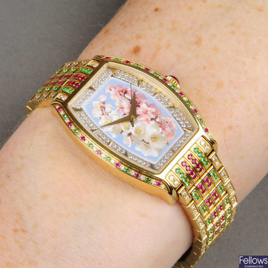 An 18ct gold diamond, ruby and emerald watch, with