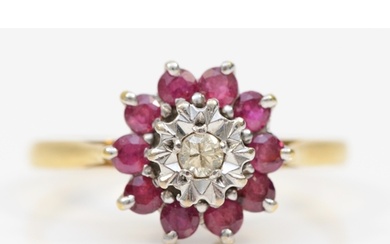 An 18ct gold ruby and brilliant cut diamond cluster ring, R-...