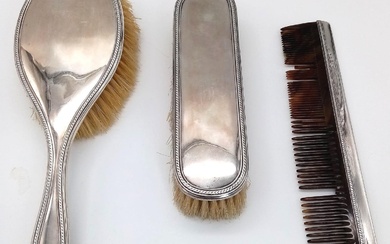 An Antique Sterling Silver Hair, Clothes Brush and Comb...