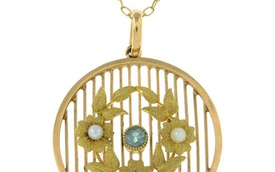 An Edwardian 15ct gold aquamarine and seed pearl lattice pendant, with 9ct gold trace-link chain.
