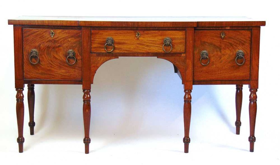 An early 19th century mahogany breakfront sideboard, the top over...