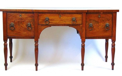 An early 19th century mahogany breakfront sideboard, the top over...