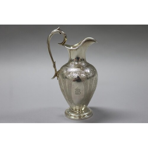 Antique Victorian sterling silver baluster jug, scroll handl...