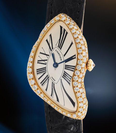 Cartier, A splendid and well-preserved yellow gold and diamond-set asymmetrical wristwatch