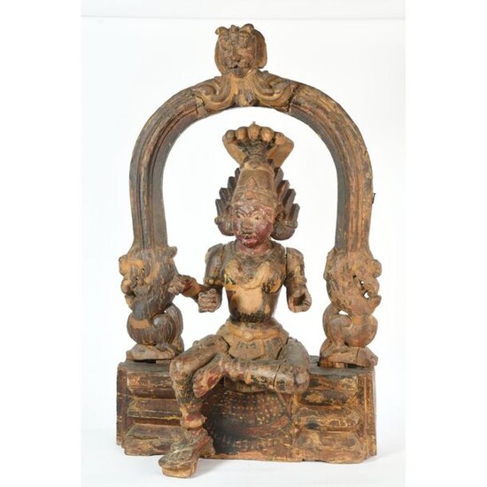 Carved, patinated and polychrome wood SUBJECT representing a deity sitting on an element representing a temple composed of fantastic animals and masks. The deity has several arms. (Missing). Indian work of the 19th century. H.93 L.55.