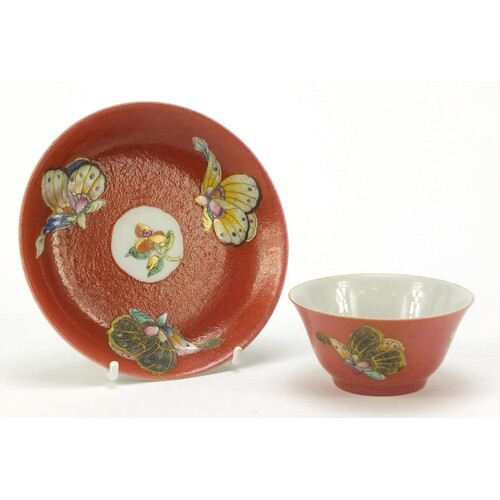 Chinese red ground porcelain tea bowl and saucer hand painte...