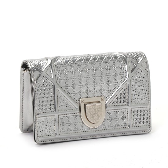 Christian Dior: A “Diorama Mini” bag made of silver metallic micro cannage leather with a removable chainstrap.