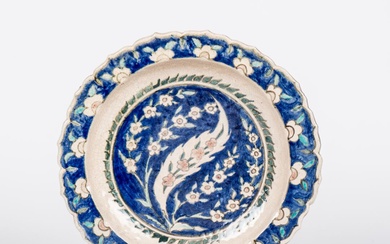 Edmond LACHENAL (1855-1948). Plat en céramique émaillée polychrome à décor persan de fleurs et rinceaux,...