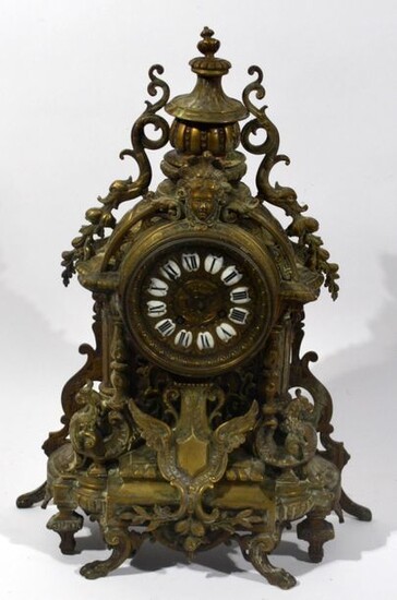 HANGING in gilt bronze with round dial with black enamelled...