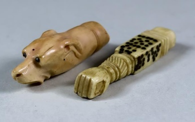 I* An Ivory Dog Whistle, 19th Century, carved as...