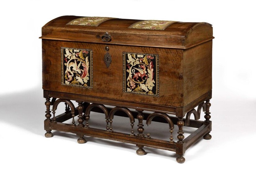Large walnut chest with domed lid, resting on a turned wooden base with fabric inlays (reported at a later date). Early 18th century (accidents and missing items). H: 103 cm, W: 128 cm, D: 66 cm