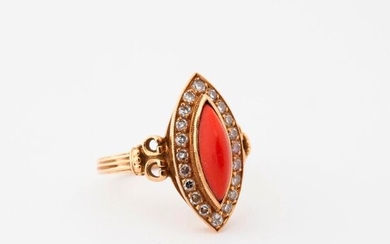 Marquise ring in yellow gold (750) centered on a cabochon of red coral (Corallium spp) (Corallidae spp) (NR) in a ring of eight-eight cut diamonds in gem-set.