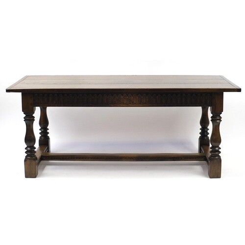 Oak refectory dining table, raised on four baluster turned l...