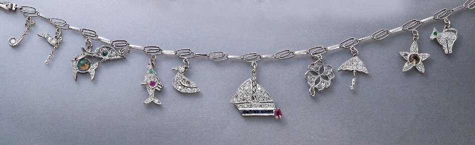 Platinum charm bracelet with diamonds , different...