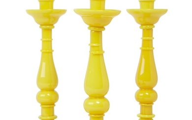 Three Venetian canary yellow glass candlesticks