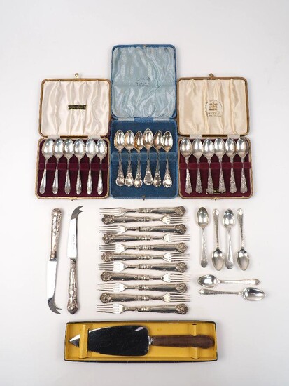 Three cased sets of silver teaspoons, including a Victorian set, London, 1854, H J Lias & Son, with shell and scroll terminals; together with eleven silver dessert forks; six various silver coffee spoons; a silver handled cheese knife and further...