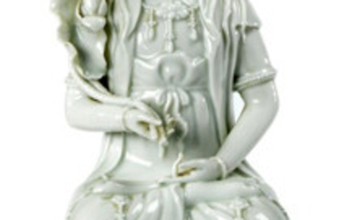 White porcelain Kwan In. China. Shown seated holding...