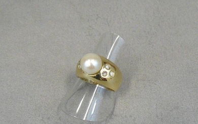 A gold ring (owl) with an 8mm cultured pearl, set...
