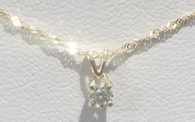 14K yellow gold necklace and pendant set with a new 0.15ct natural diamond.